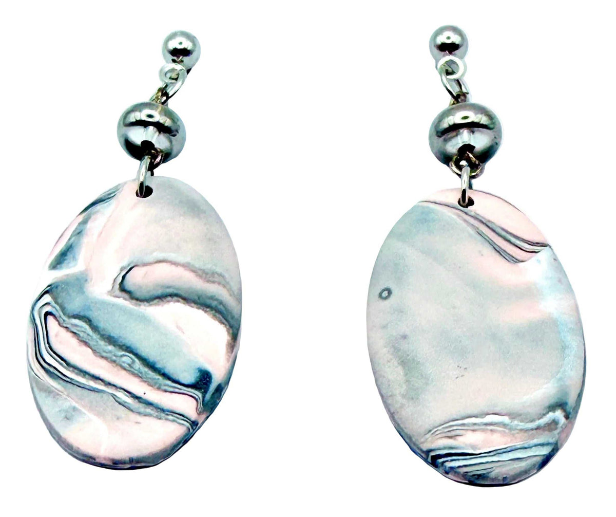 A pair of handmade dangle earrings featuring polished, marbled soapstone discs in shades of silver, gray, and white, suspended from silver ball studs on a plain white background.