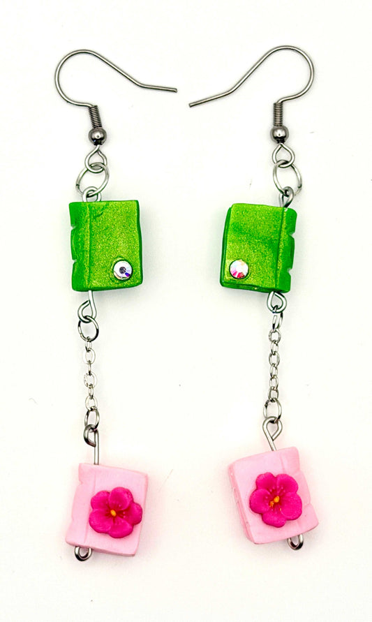 Handmade statement earrings featuring two tiny books hanging by a silver chain and hook.