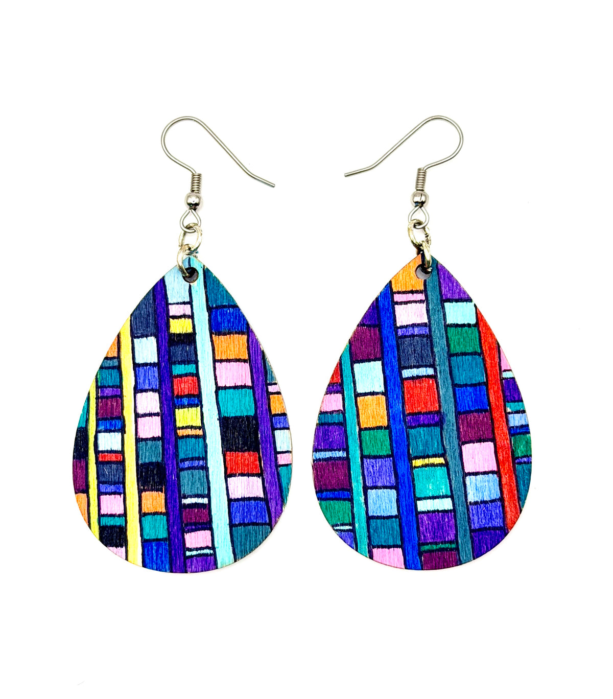A pair of teardrop-shaped wood earrings with colorful painted patterns in vertical stripes, hanging from silver fishhook wires on a plain white background.
